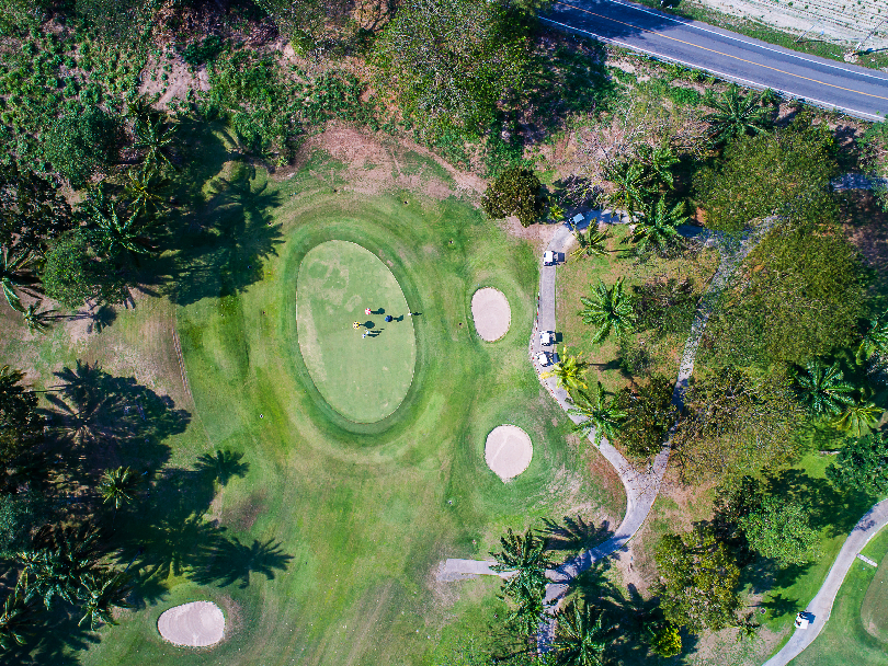 Aerial view of a Mediterranean golf remodeling project showcasing target fairways and native macchia landscaping